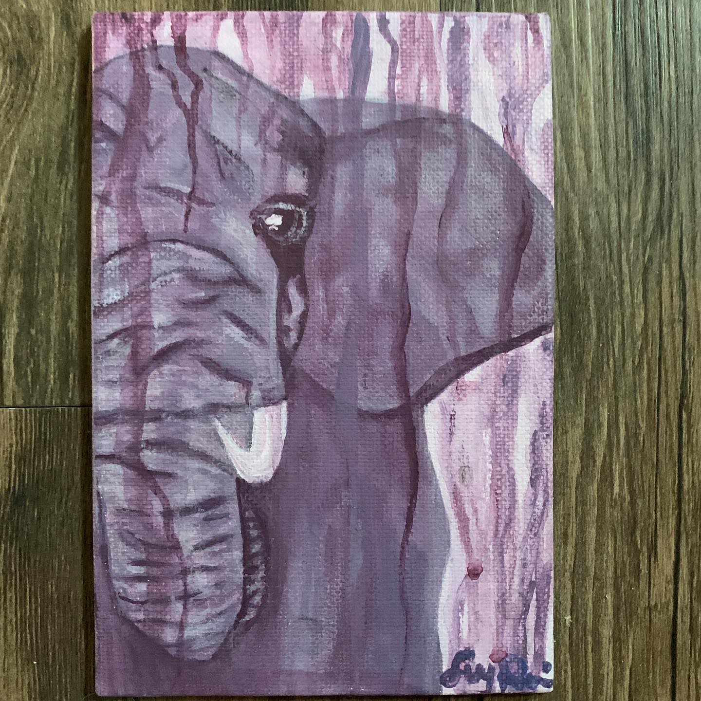 Elephant painted in violet tones