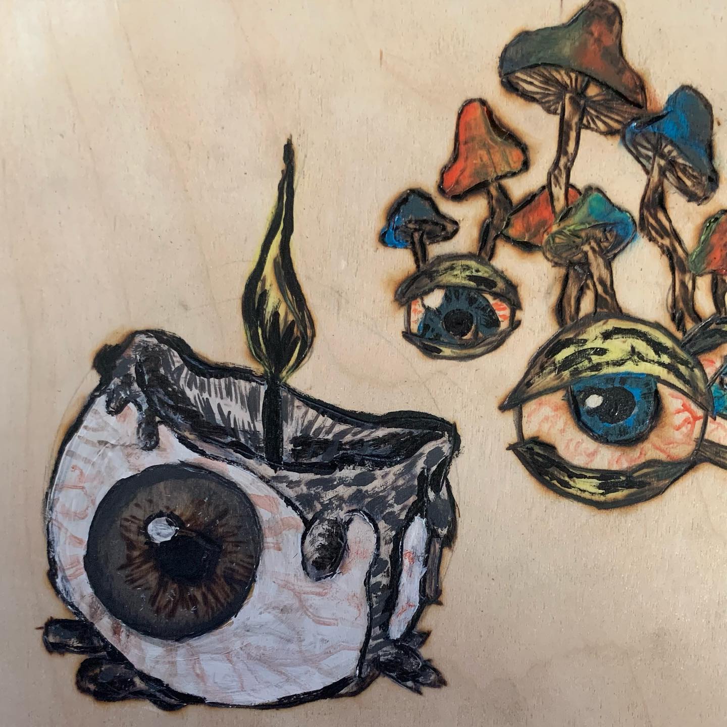 Surreal drawing of eyes and mushrooms