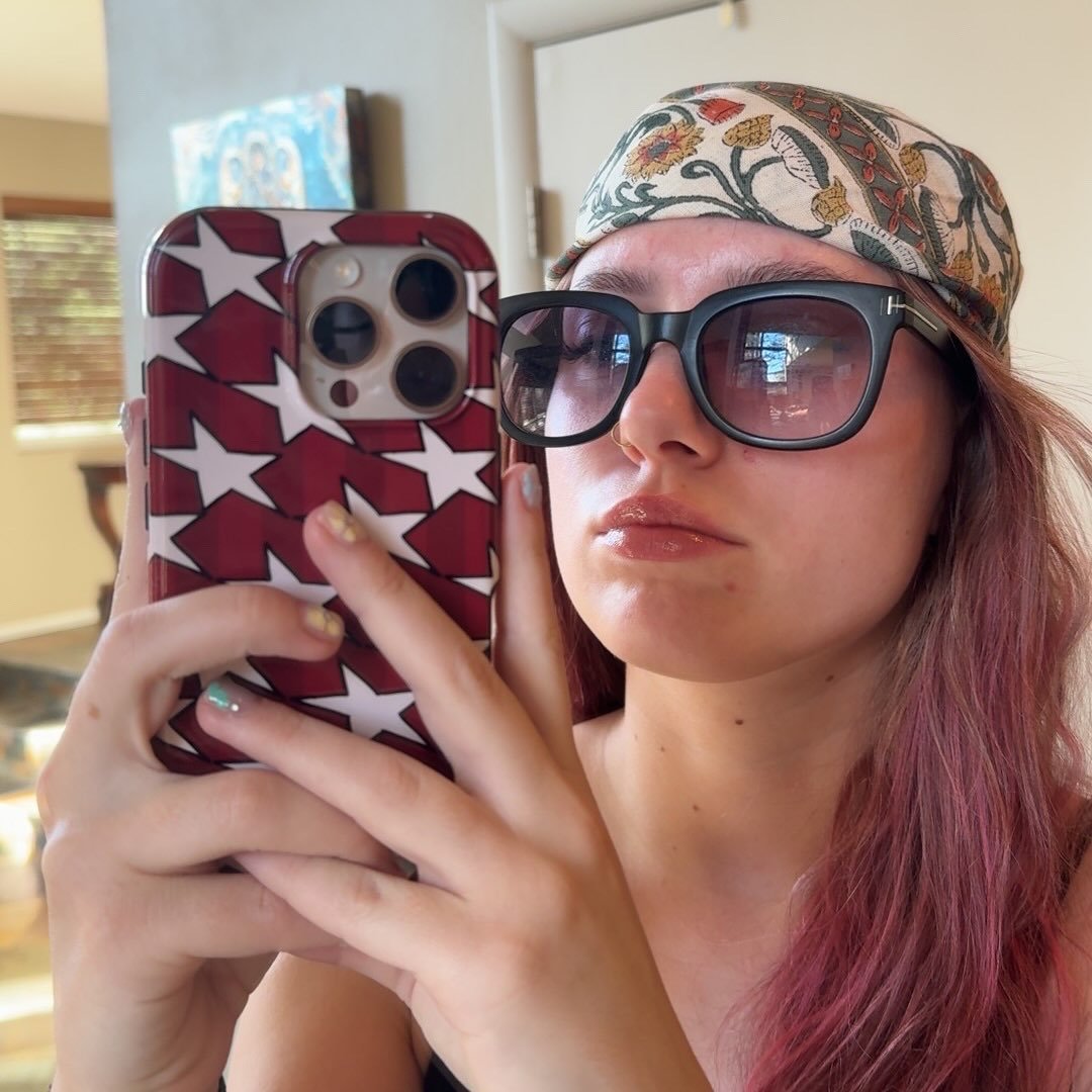 Ivy Perrin wearing glasses and a patterned headscarf