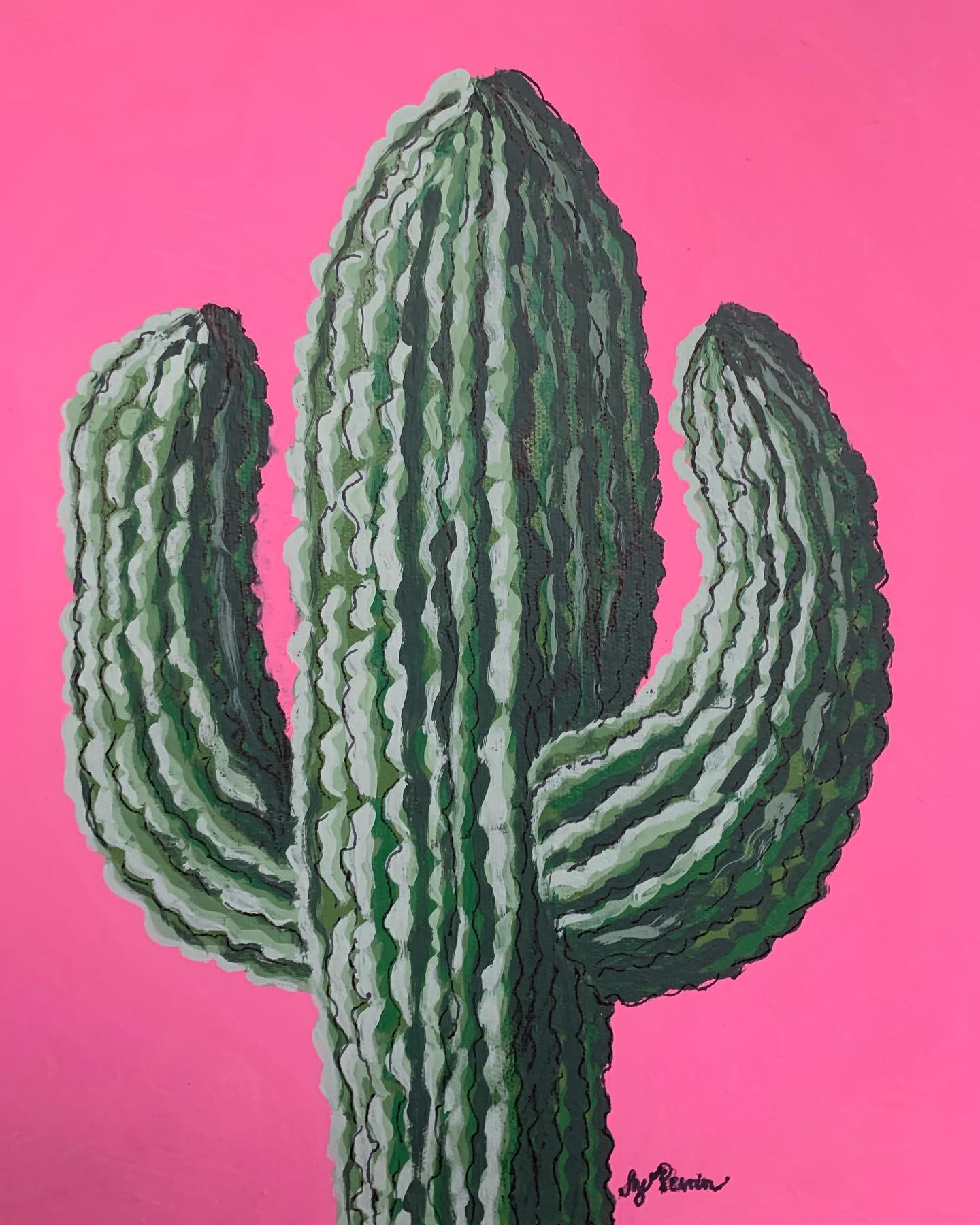 Green saguaro cactus against a vivid pink background